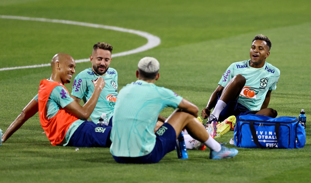 Brazil's Fabinho, Everton Ribeiro and Rodrygo during training at the Al Arabi SC Stadium, Doha, Qatar, on December 6, 2022.  REUTERS/Ibraheem Al Omari
 