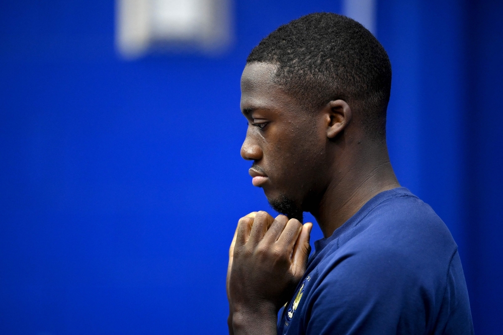 France's defender Ibrahima Konate waits ahead of a press conference at the Al Sadd SC Stadium in Doha on December 7, 2022, during the Qatar 2022 World Cup football tournament. - France and England will meet in one of the Qatar 2022 World Cup quarter-finals on December 10. (Photo by FRANCK FIFE / AFP)