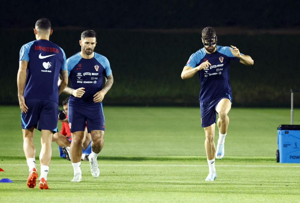 Croatia's Marko Livaja and Josko Gvardiol during a FIFA World Cup Qatar 2022 training at the Al Erssal Training Site 3, Doha, Qatar, on December 7, 2022.  REUTERS/Suhaib Salem