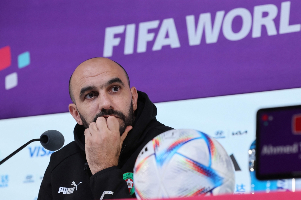 Morocco's coach Walid Regragui addresses a press conference at the Qatar National Convention Center (QNCC) in Doha on December 9, 2022, on the eve of the Qatar 2022 World Cup quarter-final football match between Morocco and Portugal. (Photo by KARIM JAAFAR / AFP)