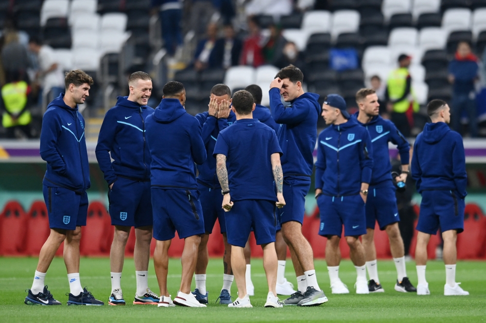 England's Kyle Walker with teammates on the pitch before the FIFA World Cup Qatar 2022 quarter final match against France at the Al Bayt Stadium, Al Khor, Qatar, on December 10, 2022.  REUTERS/Annegret Hilse