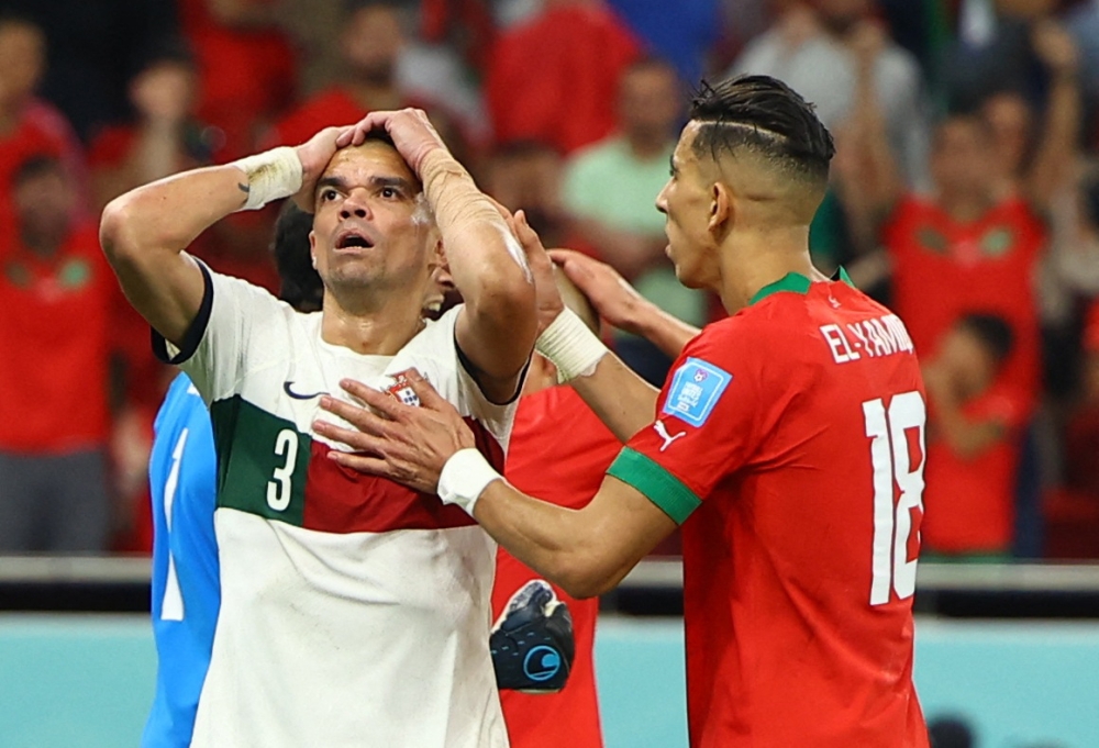 Portugal's Pepe reacts after a missed chance alongside Morocco's Jawad El Yamiq during their FIFA World Cup Qatar 2022 quarter final clash at the Al Thumama Stadium, Doha, Qatar, on December 10, 2022. REUTERS/Molly Darlington