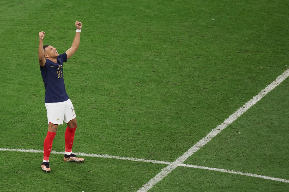 France's forward #10 Kylian Mbappe celebrate his team's victory in the Qatar 2022 World Cup quarter-final football match between England and France at the Al-Bayt Stadium in Al Khor, north of Doha, on December 10, 2022. (Photo by JACK GUEZ / AFP)