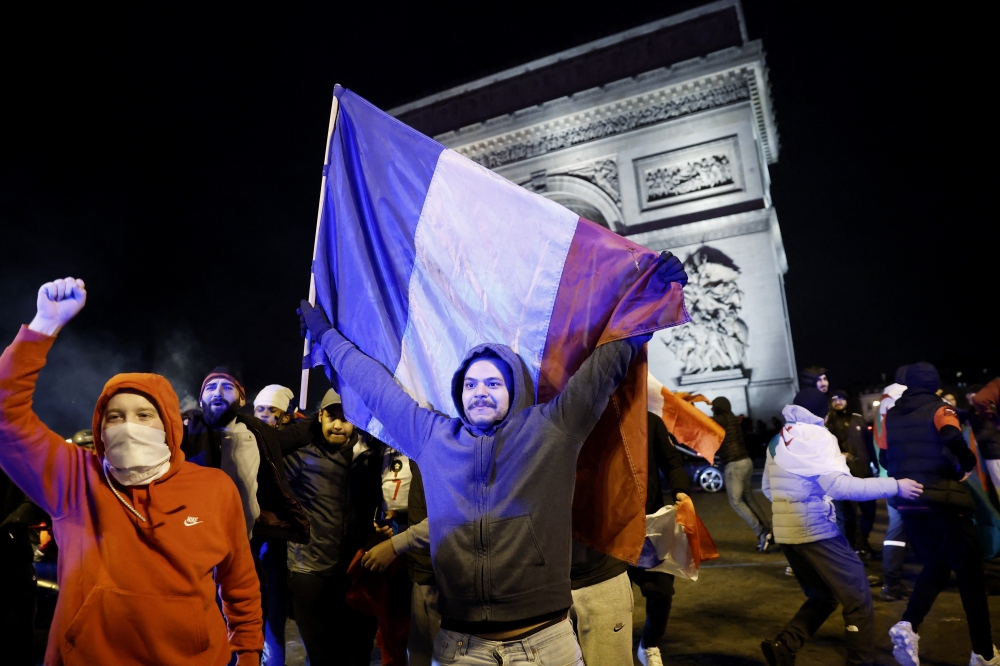 Morocco fans celebrate in Paris after the match as Morocco defeated Portugal to progress to the semi-finals of FIFA World Cup Qatar 2022 on December 10, 2022. REUTERS/Benoit Tessier.