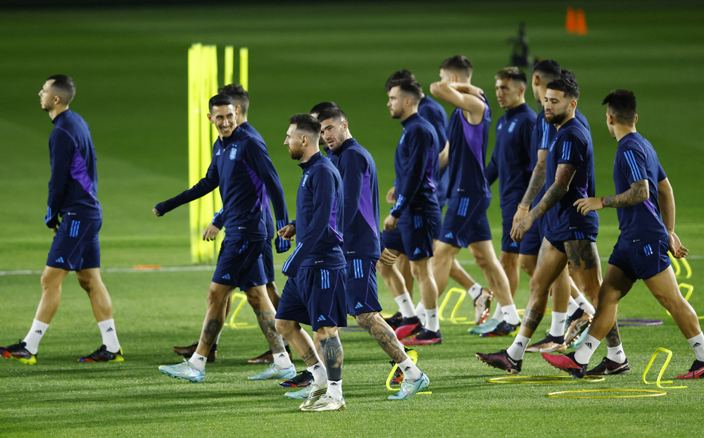 Argentina’s Lionel Messi with teammates during a training session at Qatar University Training Site 3, yesterday. REUTERS