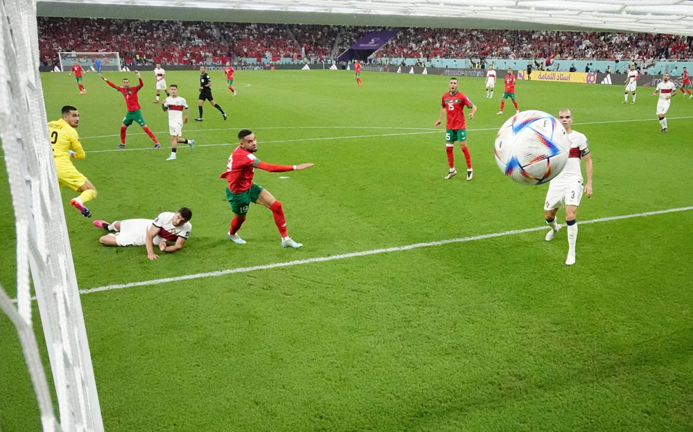 Morocco’s Youssef En-Nesyri scores against Portugal during their quarter-final match at Al Thumama Stadium, on Saturday. REUTERS