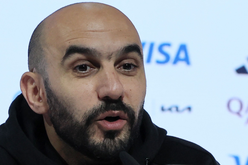 Morocco's coach Walid Regragui speaks during a press conference in Doha on December 13, 2022, a day ahead of the Qatar 2022 World Cup football semi-final match against France. (Photo by KARIM JAAFAR / AFP)