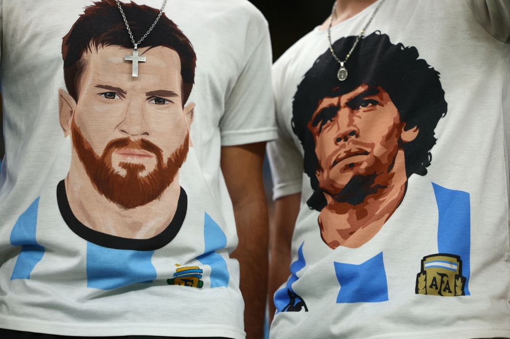 Argentina fans wear Lionel Messi and former player Diego Maradona shirts inside the stadium before the Argentina vs Croatia semi-final match at Lusail Stadium, Lusail, Qatar, on December 13, 2022 REUTERS/Molly Darlington