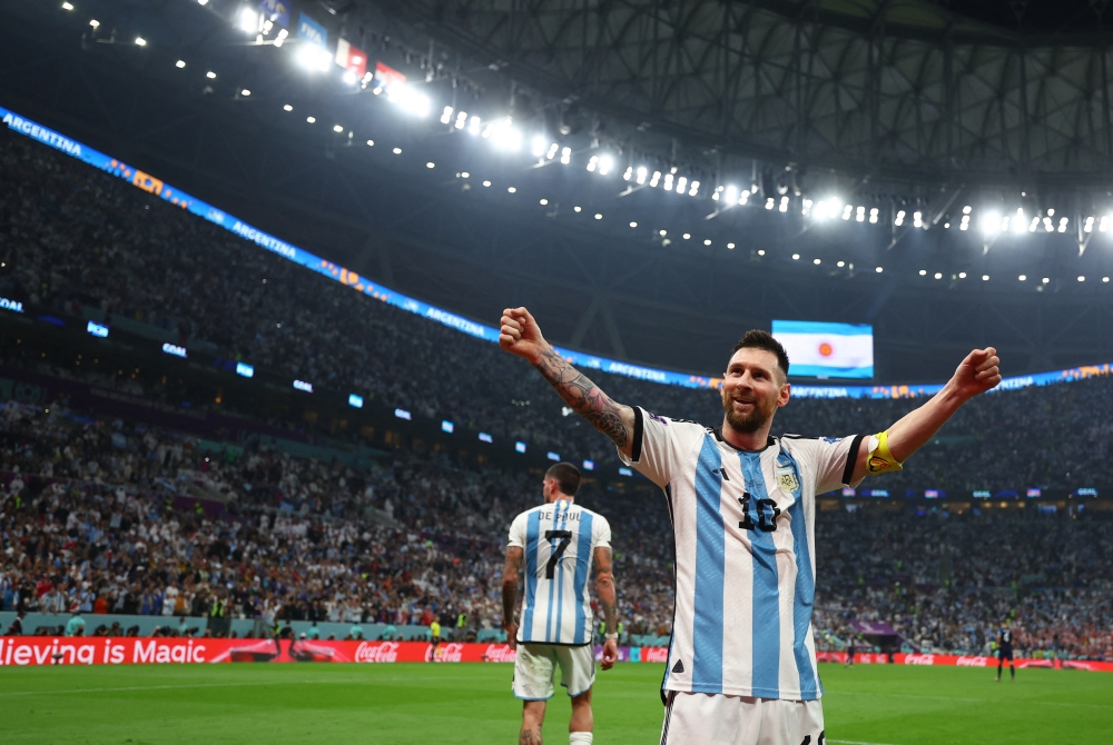 Argentina's Lionel Messi celebrates their third goal scored by Julian Alvarez during the semi-final match against Croatia at the Lusail Stadium, Qatar, on December 13, 2022. REUTERS/Molly Darlington