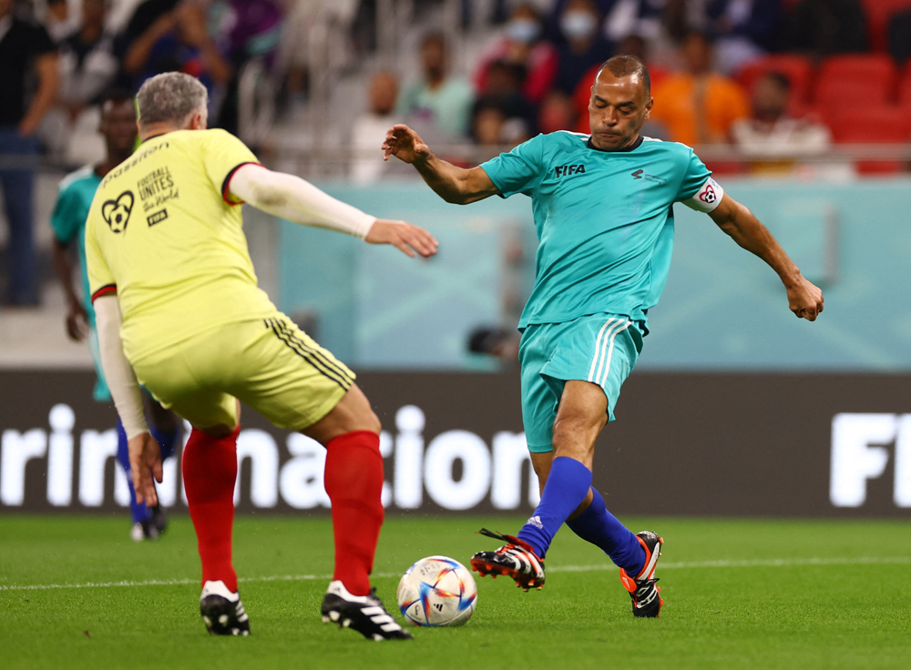 Former Brazil player Cafu in action during the match. REUTERS