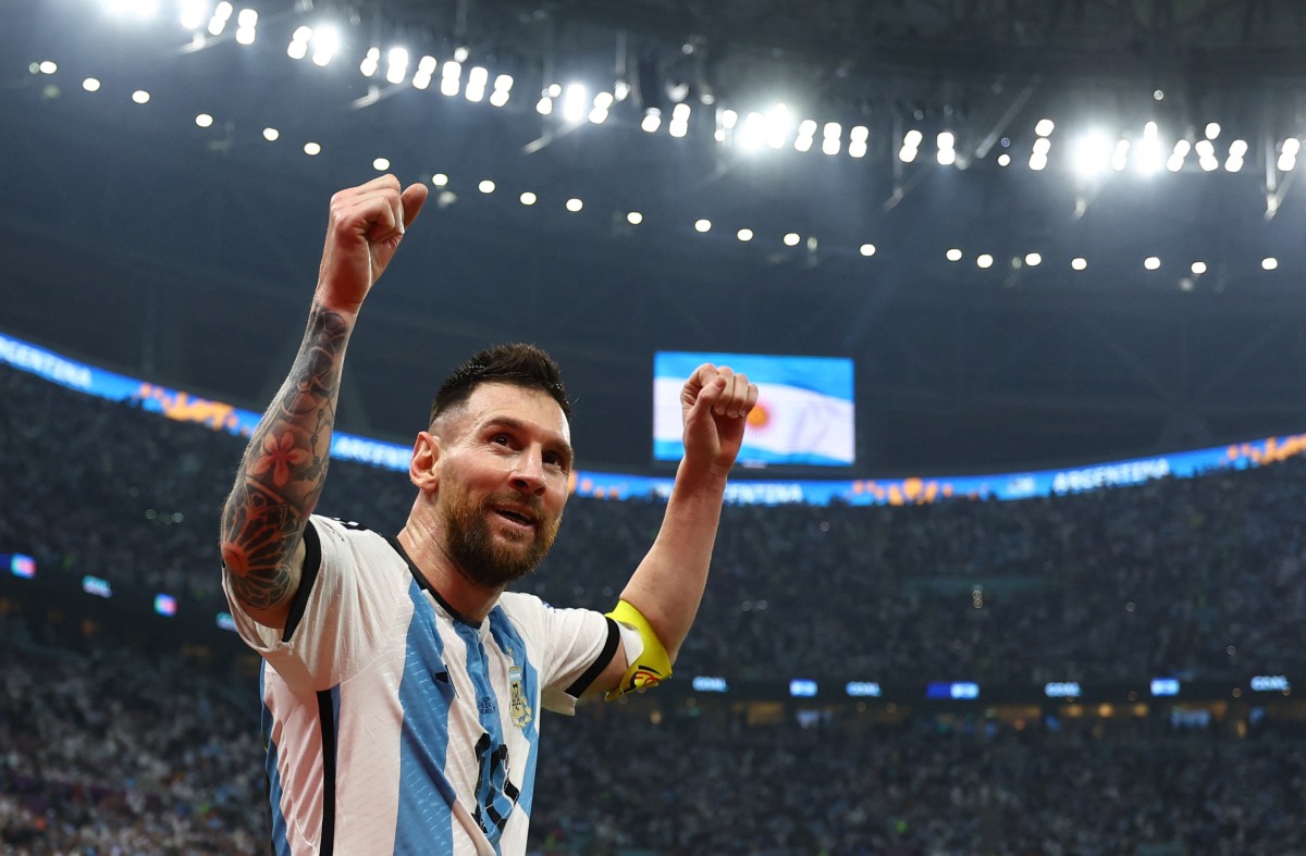 Lionel Messi celebrates after assisting Julian Alvarez for their third goal against Croatia. REUTERS