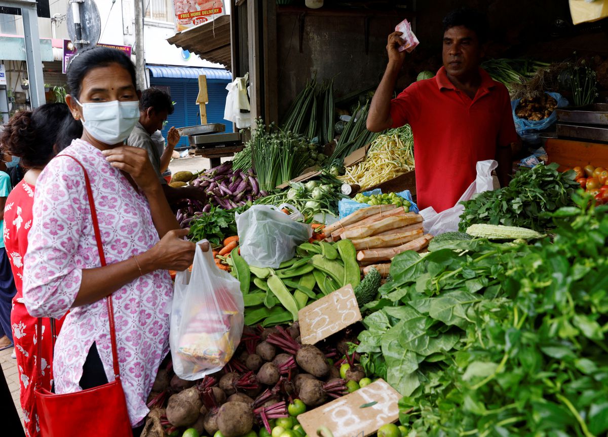 File Photo: A vendor sells vegetables to a customer amid the rampant food inflation, amid Sri Lanka's economic crisis, in Colombo, Sri Lanka, July 29 , 2022. (REUTERS/Kim Kyung-Hoon)