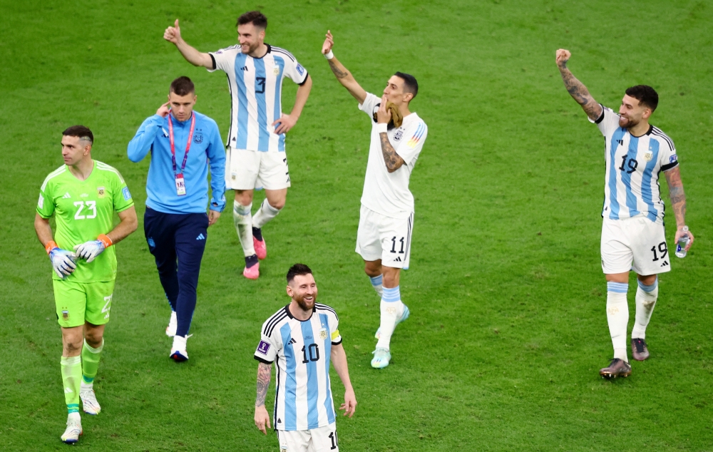 Argentina's Lionel Messi, Angel Di Maria, Nicolas Otamendi, Emiliano Martinez and Nicolas Tagliafico celebrate qualifying for the World Cup final. (REUTERS/Hannah Mckay)