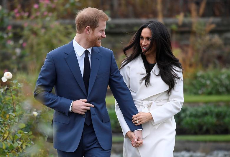 File Photo: Britain's Prince Harry with Meghan Markle in the Sunken Garden of Kensington Palace, London, Britain, November 27, 2017. (REUTERS/Toby Melville)