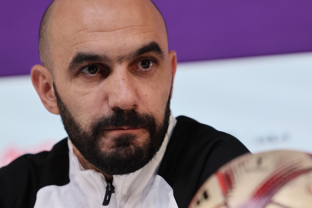 Morocco's coach Walid Regragui gives a press conference at the Qatar National Convention Center (QNCC) in Doha on December 16, 2022, on the eve of the Qatar 2022 World Cup third place football match between Croatia and Morocco. (Photo by KARIM JAAFAR / AFP)