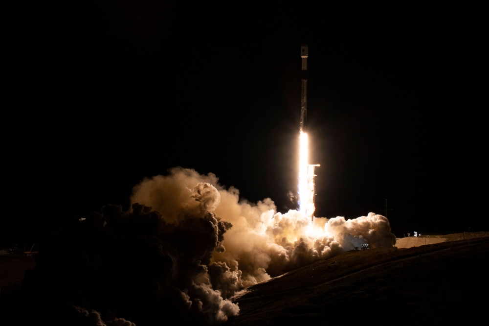 In this image released by NASA, a SpaceX Falcon 9 rocket with NASA's Surface Water and Ocean Topography (SWOT) satellite lifts off from Vandenberg Air Force Base, in Santa Barbara, California, on December 16, 2022. (Photo by Keegan Barber / NASA / AFP)