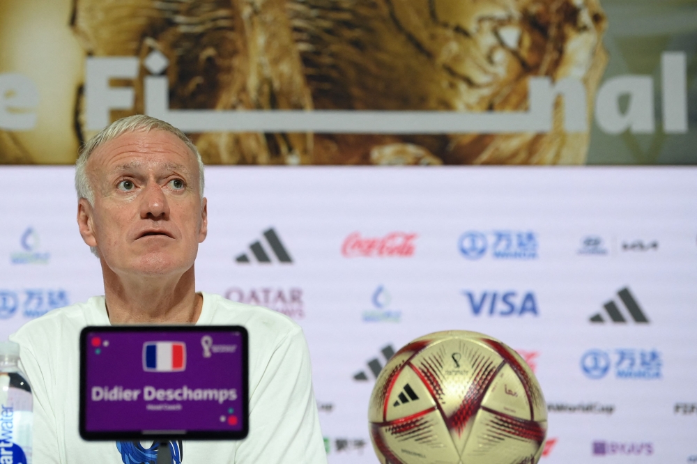 France's coach Didier Deschamps gives a press conference in Doha on December 17, 2022 on the eve of the Qatar 2022 World Cup football match between Argentina and France. (Photo by FRANCK FIFE / AFP)