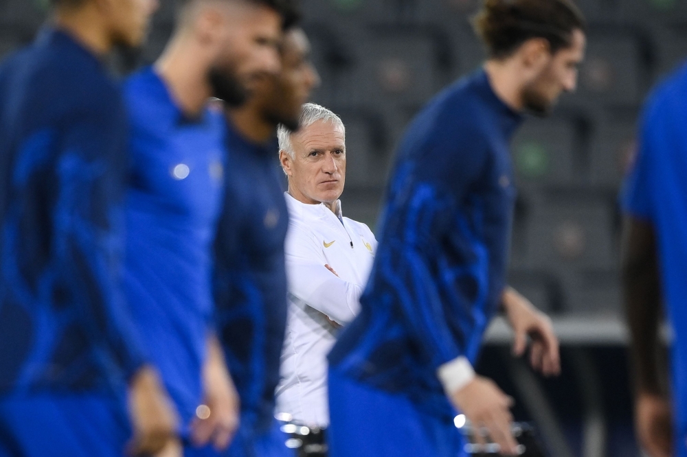 France's coach Didier Deschamps takes part in a training session at the Al Sadd SC training centre in Doha on December 17, 2022, on the eve of the Qatar 2022 World Cup football final match between Argentina and France. (Photo by FRANCK FIFE / AFP)