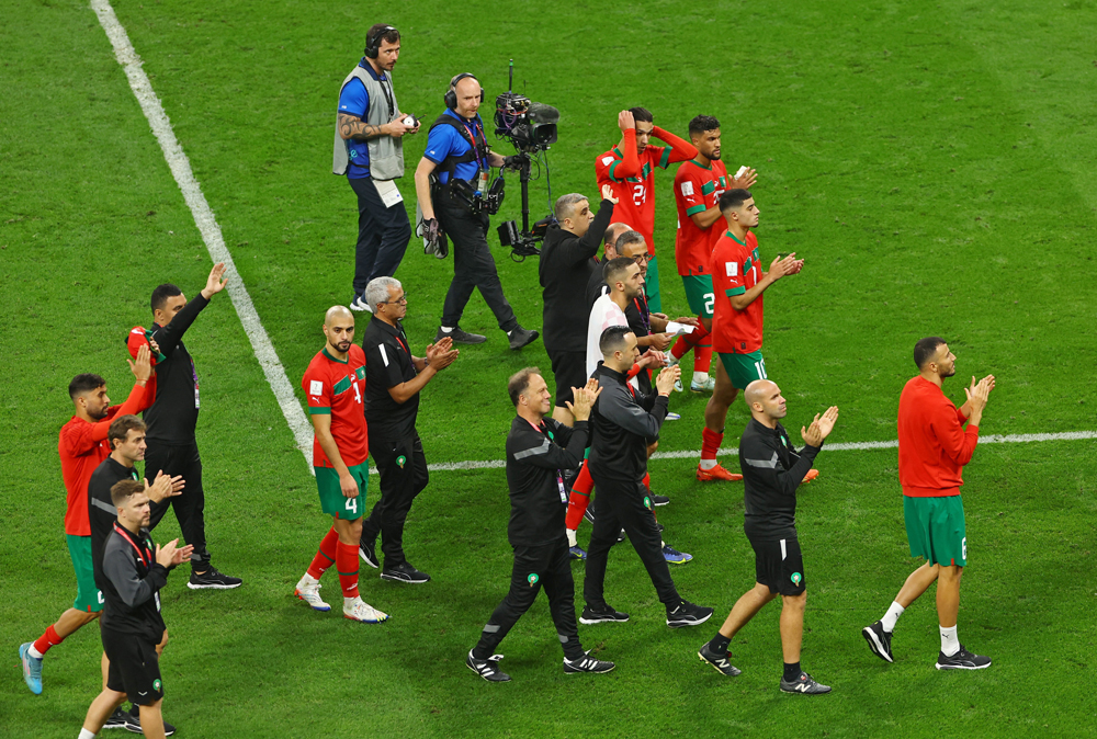 Morocco players and officials applaud the fans after their third-place match against Croatia at the Khalifa International Stadium yesterday.  REUTERS