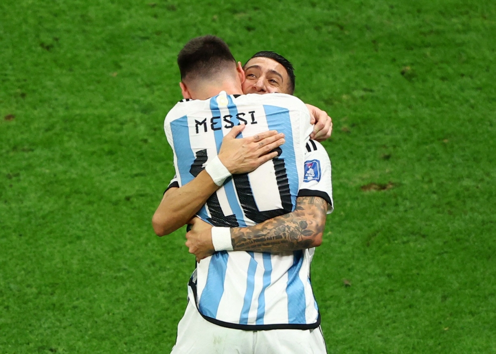 Argentina's Lionel Messi celebrates scoring their first goal with Angel Di Maria REUTERS/Bernadett Szabo