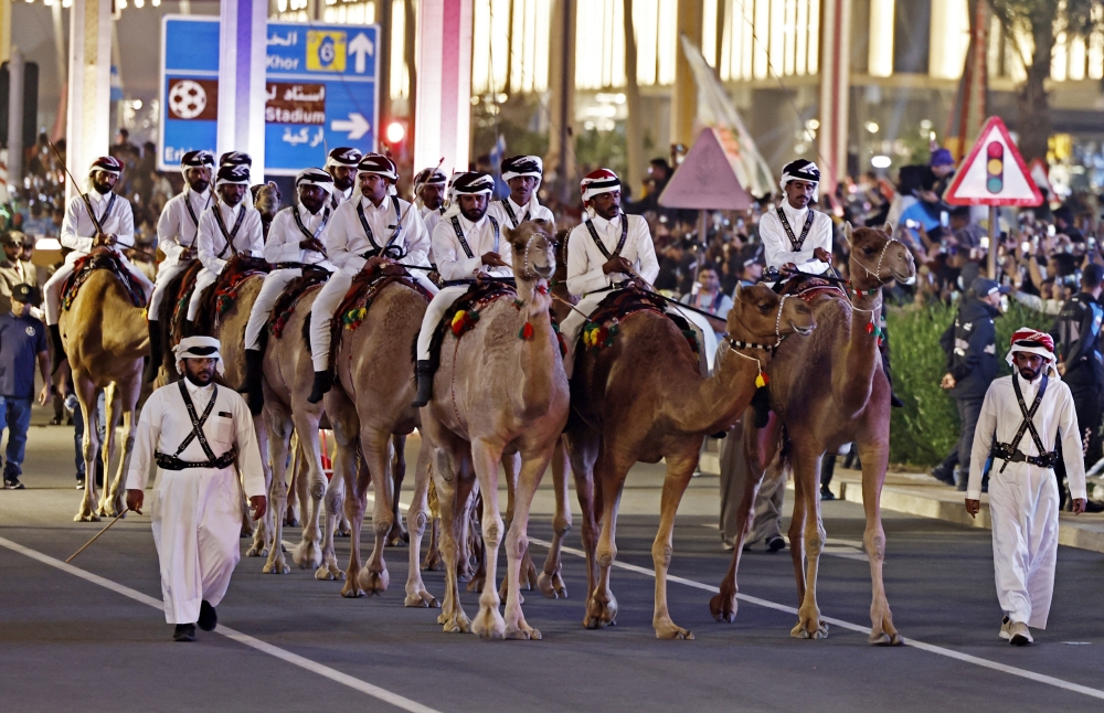 Qatar mounted camel police escort Argentina players on a bus outside the Lusail Stadium after winning the World Cup on December 18, 2022.  REUTERS/Hamad I Mohammed