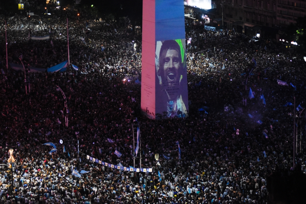 Argentina fans celebrate winning the FIFA World Cup at the Obelisk with an image of Leo Messi in Buenos Aires, Argentina on December 18, 2022.  REUTERS/Mariana Nedelcu
 