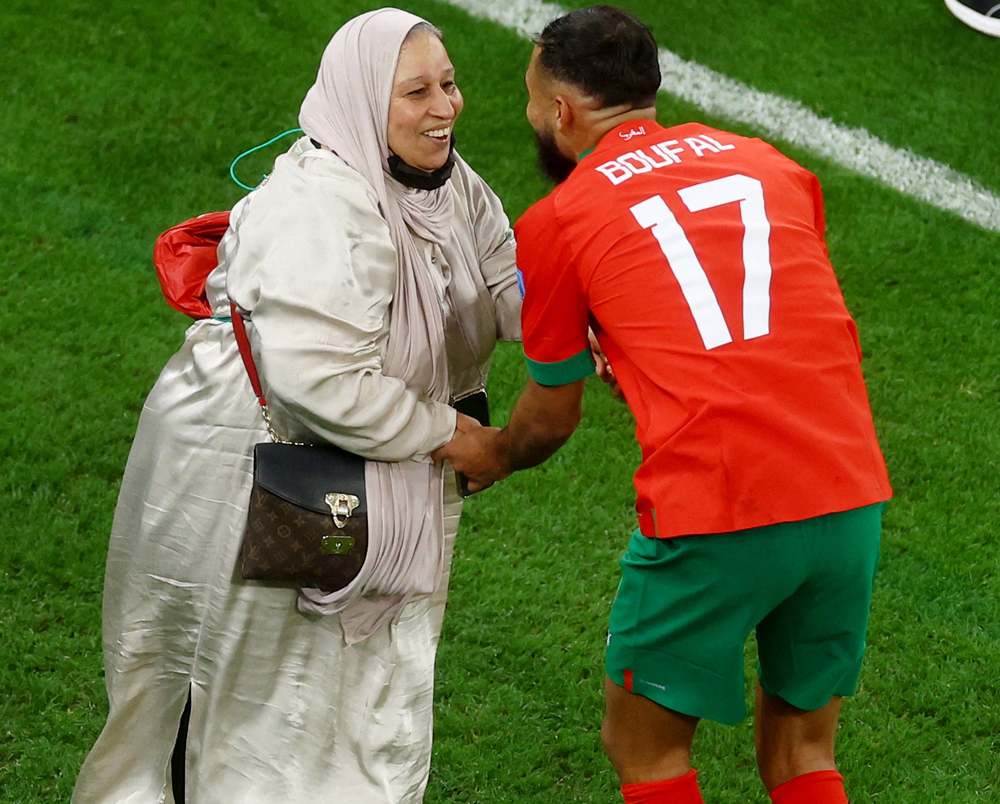 Morocco’s Sofiane Boufal celebrates with his mother as Morocco progress to the semi finals. 