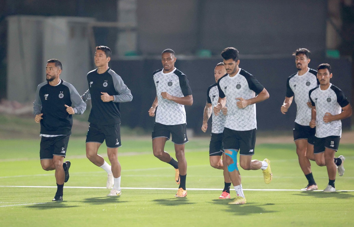 Al Sadd players attend a training session.