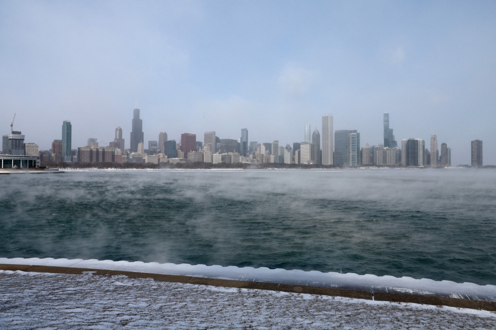 Mist rises from Lake Michigan in Chicago on December 23, 2022, where temperatures reached -6F (-21C) ahead of the Christmas holiday. Photo by Kamil Krzaczynski / AFP