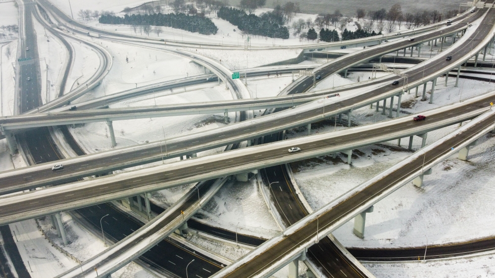 Vehicles move along a highway in Louisville, Kentucky, under freezing temperatures on December 23, 2022. (Photo by Leandro Lozada / AFP)