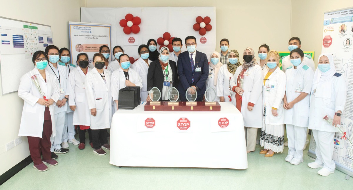 Hamad Medical Corporation staff members marking the World Pressure Injury Prevention Day.