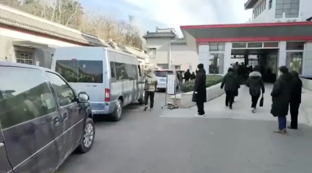 Vehicles queue outside a funeral home, amid the coronavirus disease (COVID-19) outbreak, in Beijing, China in this still image taken from a social media video released December 29, 2022. Video Obtained By Reuters