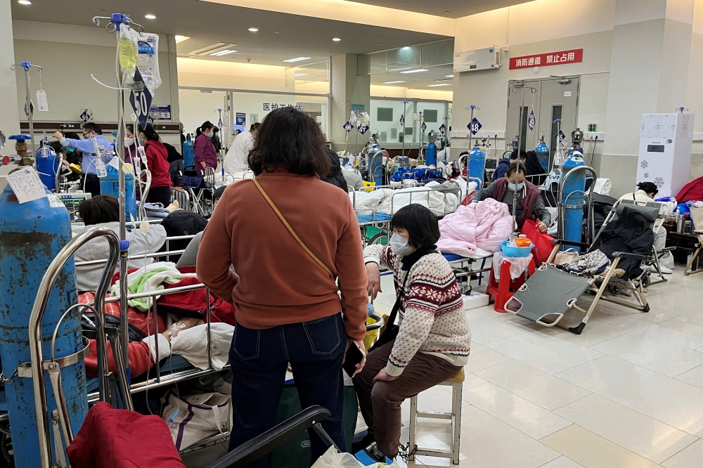 Patients lie on beds at the emergency department of Zhongshan Hospital, amid the coronavirus disease (COVID-19) outbreak in Shanghai, China January 3, 2023. Reuters/Staff