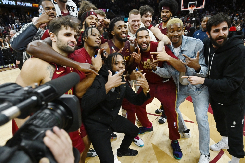 The Cleveland Cavaliers celebrate with guard Donovan Mitchell (45) after the game between the Cavaliers and the Chicago Bulls at Rocket Mortgage FieldHouse. Ken Blaze