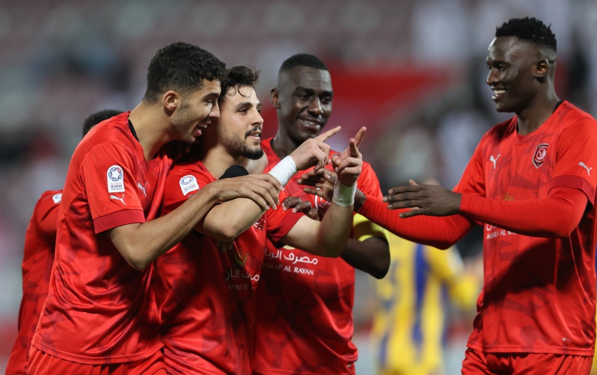 Bassam Al Rawi celebrates with teammates after scoring Al Duhail's second goal yesterday. 