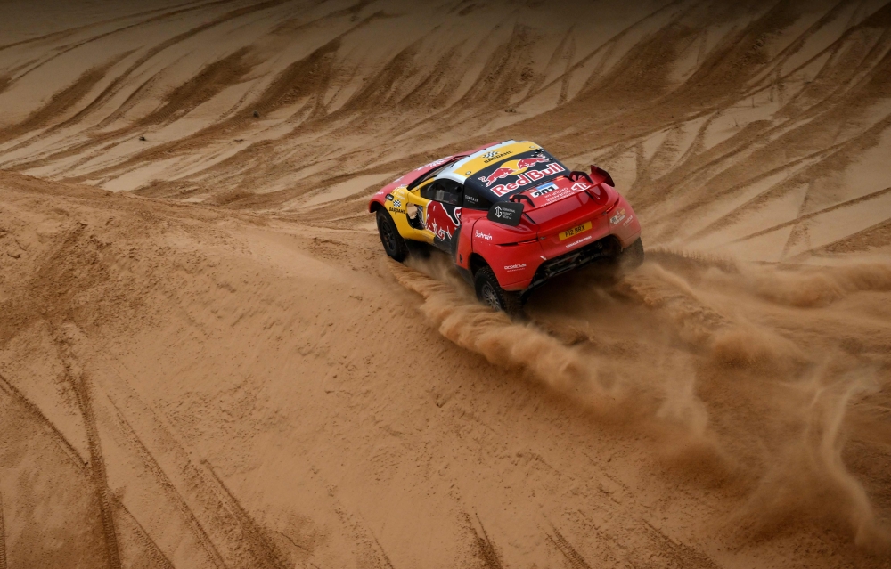 BRX's French driver Sebastien Loeb and Belgian co-driver Fabian Lurquin compete during Stage 8 of the Dakar 2023 between Al Duwadimi and Riyadh, Saudi Arabia, on January 8, 2023. (Photo by FRANCK FIFE / AFP)