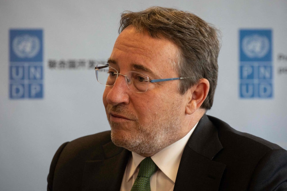 In this file photo taken on September 2, 2022 Administrator of the United Nations Development Programme, Achim Steiner, speaks during an interview at the Development Programme Headquarters in New York.  (Photo by Yuki IWAMURA / AFP)