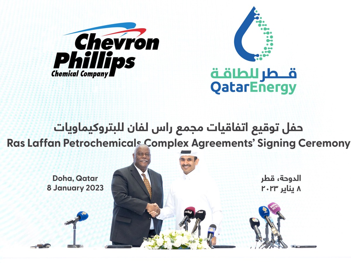 Minister of State for Energy Affairs and the President and CEO of QatarEnergy H E Saad Sherida Al Kaabi shake hands after signing the agreement with the President and CEO of Chevron Phillips Chemical Bruce Chinn.