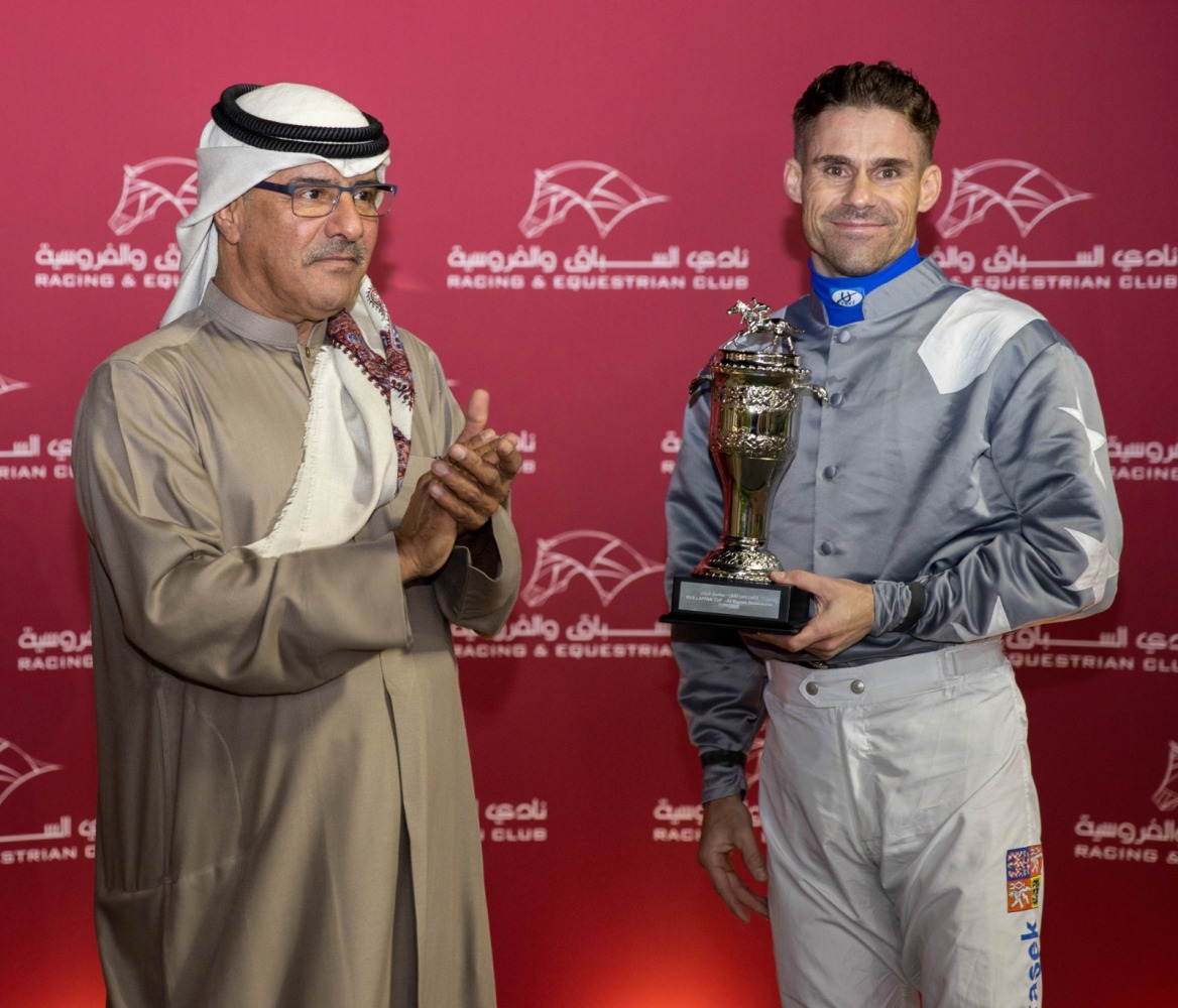 QREC Racing Manager, Abdulla Rashid Al Kubaisi after presenting the trophy to Tomas Lukasek. 
