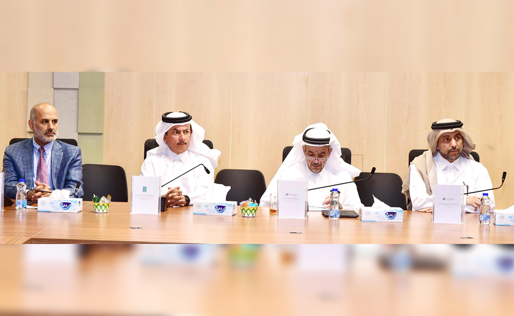 QU President Dr. Hassan Al Derham (right) with other officials during the meeting.