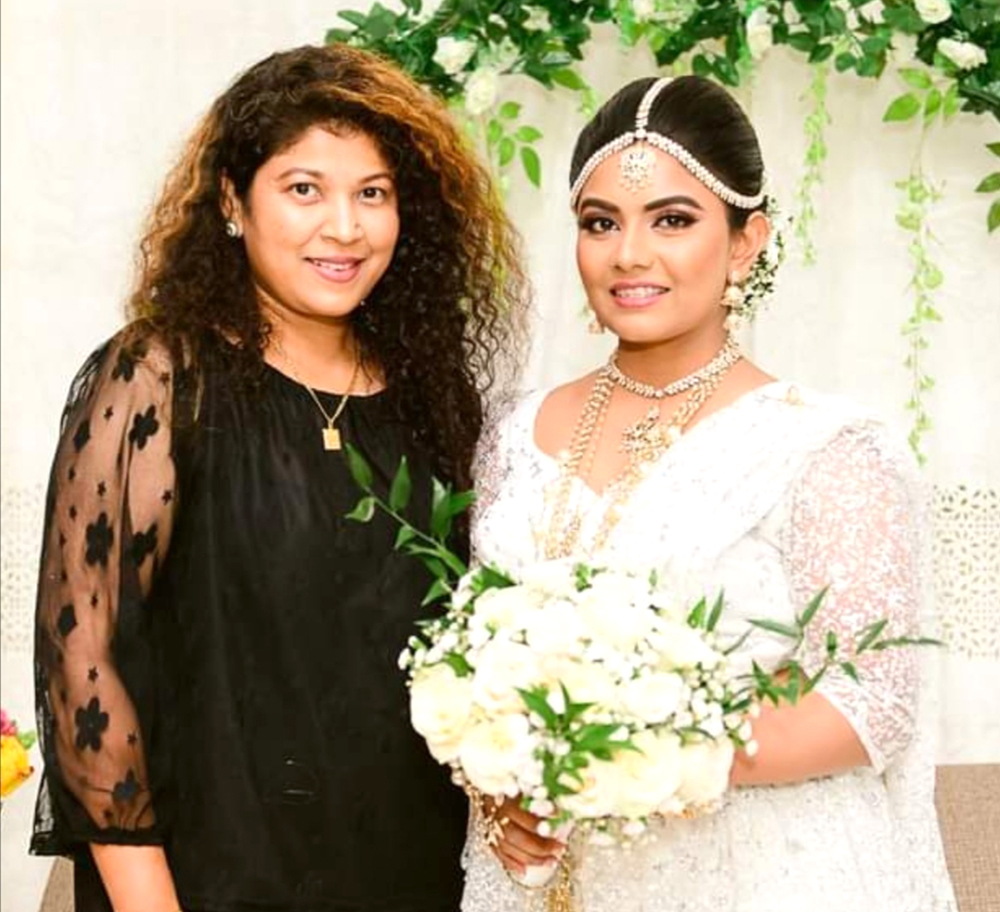 Chandrika Perera with a traditional Kandyan bride.