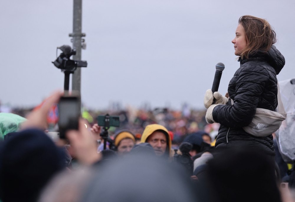 Climate activist Greta Thunberg speaks during a protest against the expansion of Germany's utility RWE's Garzweiler open-cast lignite mine to Luetzerath, Germany, on January 14, 2023. REUTERS/Thilo Schmuelgen