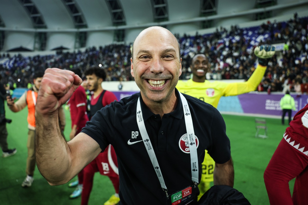 Coach Bruno Pinheiro celebrates after Qatar qualified for the semi-finals.