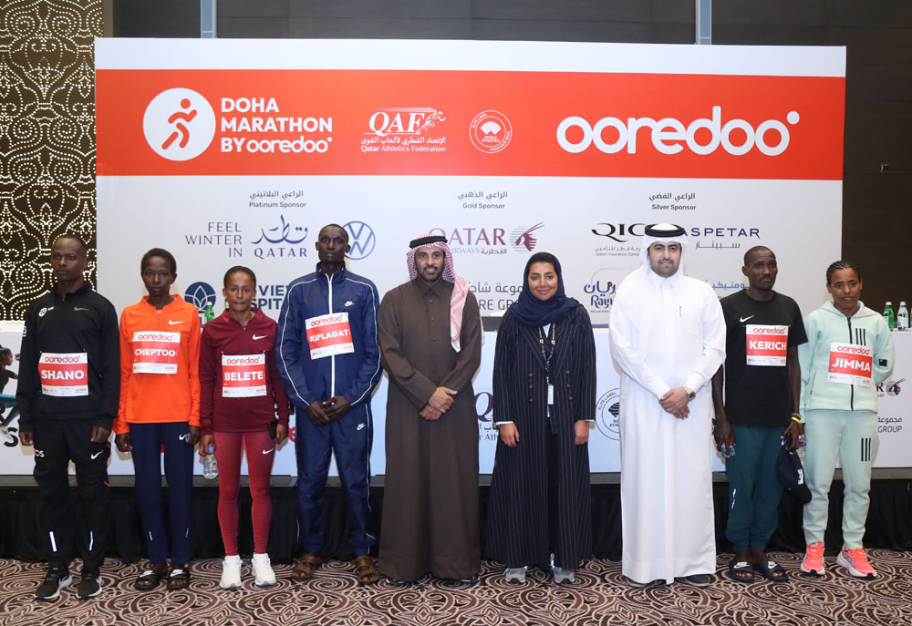 Elite athletes with the QAF President Mohammed Issa Al Fadala (fifth left), and Sabah Rabiah Al Kuwari, Director of PR at Ooredoo (third right) during a press conference yesterday. 