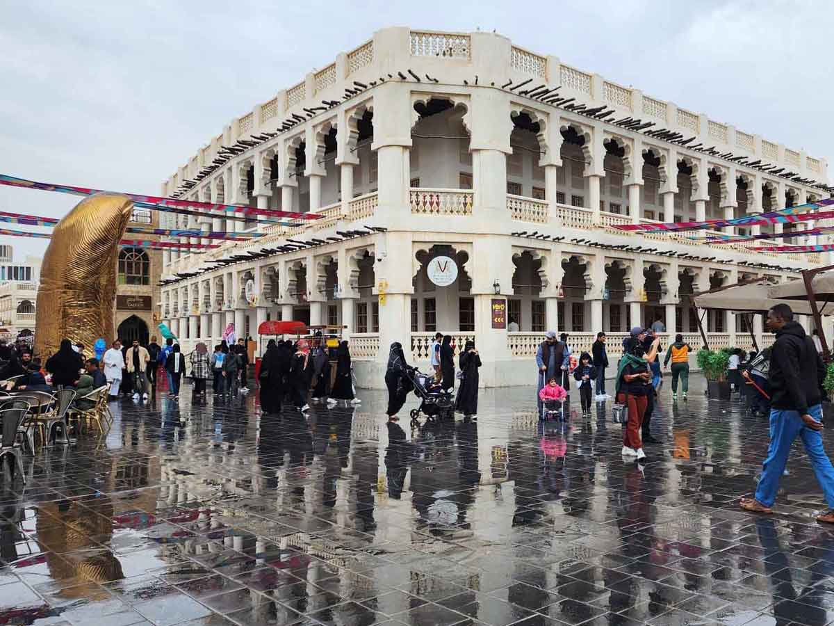 Visitors at Souq Waqif after a recent drizzle. File picture by Abdul Basit / The Peninsula clicked on January 14, 2023 