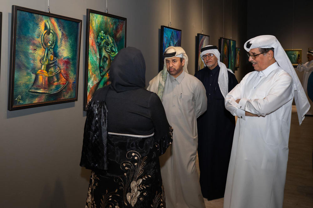 Minister of State and President of Qatar National Library H E Dr. Hamad bin Abdulaziz Al Kawari (right), and Katara General Manager Prof. Dr. Khalid bin Ibrahim Al Sulaiti, along with other officials during the opening of Acrylic Pouring Exhibition 2 at Katara.