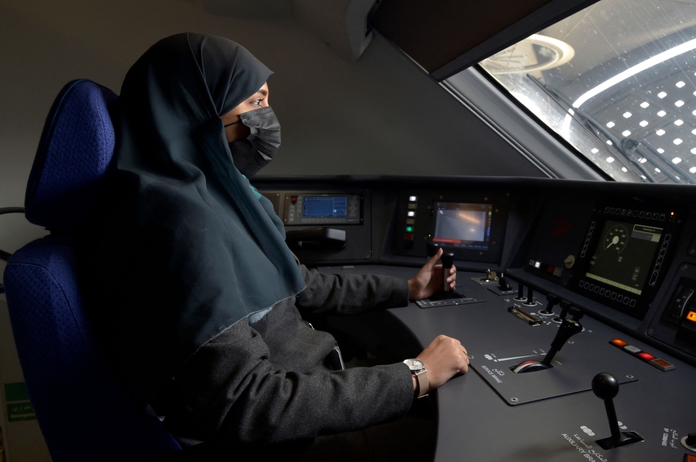 Saudi conductor Raneem Azzouz, drives a high-speed train ferrying pilgrims to Mecca, in Saudi Arabia, on January 22, 2023. (Photo by Amer Hilabi / AFP)
