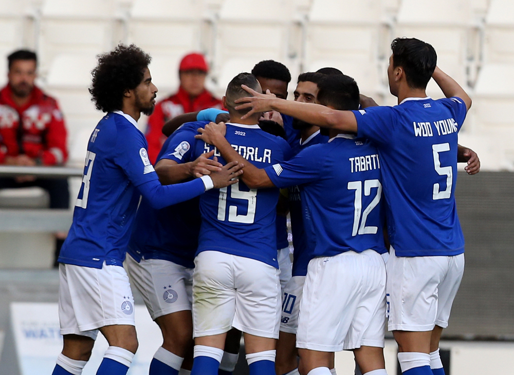 Al Sadd players celebrate after Baghdad Bounedjah scored against Al Markhiya during their QNB Stars League Round 12 match, yesterday. PICTURES: Abdul Basit