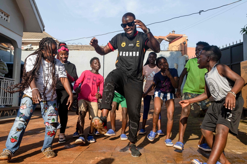 Members of Ghetto Kids, a prominent dance group in Uganda rehearse a dance routine at Big Talent Entertainment studio during a music video dance rehearsal with Ugandan musician Edrisah Musuuza, also known as Eddy Kenzo (C), in Makindye, a suburb in Kampala, Uganda, on January 20, 2023. Photo by BADRU KATUMBA / AFP