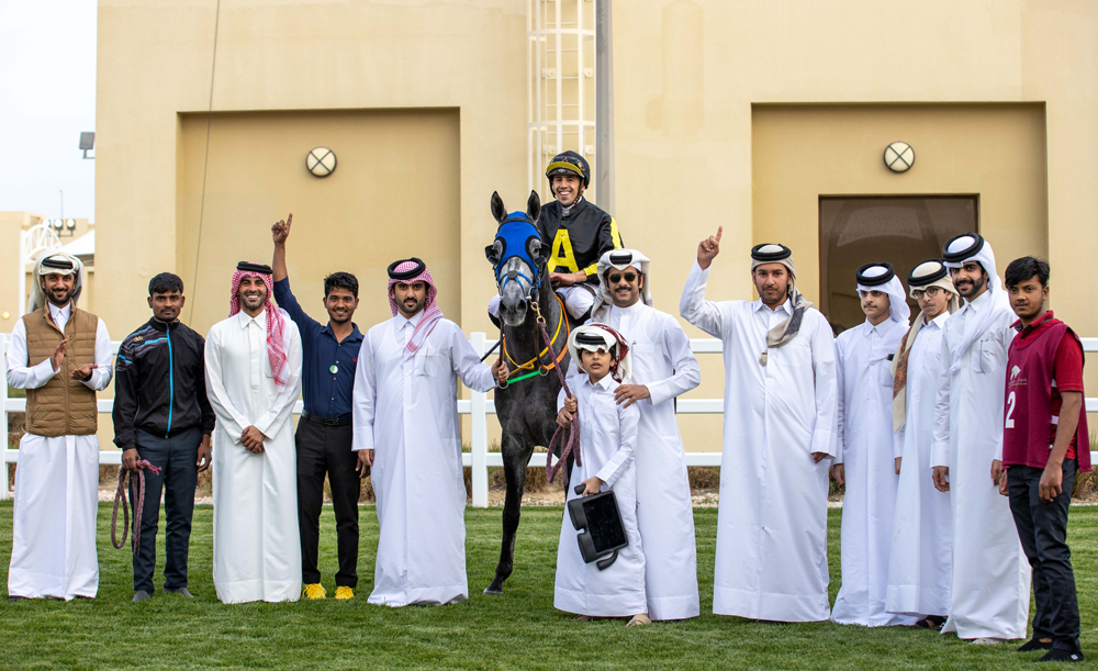 The connection of Midrass celebrate after the Ghazwan Racing’s seven-year-old horse won the Mesaieed Cup at Al Uqda Equestrian Complex, yesterday. PICTURES: JUHAIM/QREC